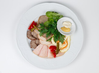 Top view of meat snacks on plate on white background