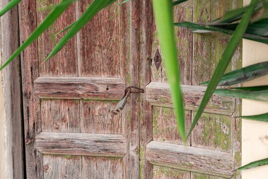 Wooden door in vintage style in the small village Pitsidia in the south-central of Crete. The village has kept his original character and is a popular destination in the south of the island 