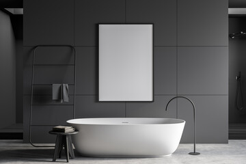 Dark grey bathroom with white ceramic bathtub and empty mockup canvas