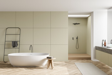 Fototapeta na wymiar Oval white bathtub in light olive bathroom space