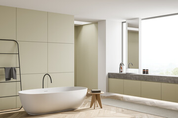 Modern olive bathroom with vanity in window niche. Corner view.