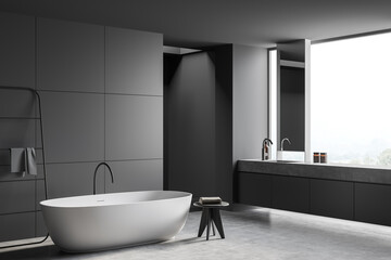 Fototapeta na wymiar Panoramic grey bathroom with vanity in window niche
