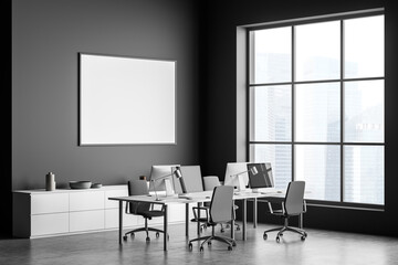 Empty horizontal canvas in panoramic grey office with work station. Corner view.