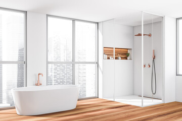 Corner view on bright bathroom interior with bathtub, shower