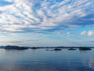 The many small Islands and Rocky Outcrops seen along the margins of Bergen Fjord on an early Summers morning in June.