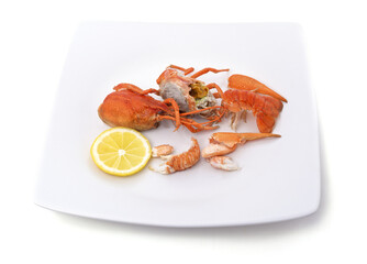 Parts of boiled crayfish with lemon.