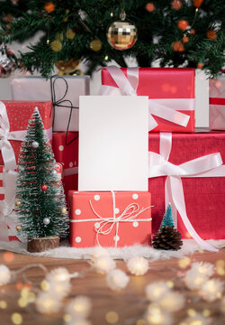 mockup christmas greeting card for invitation design and Presents under Christmas tree.