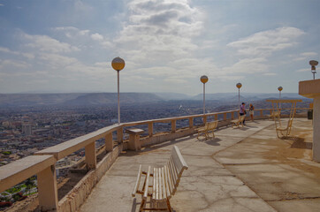 Panoramic landscape scenic view from hilltop viewing point outlook Morro de Arica over downtown and...