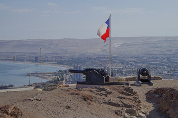 Panoramic landscape scenic view from hilltop viewing point outlook Morro de Arica over downtown and...