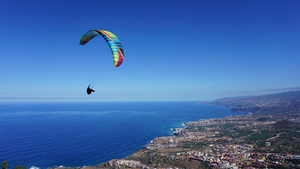 Paraglider flying above the North Coast of Tenerife, Canary Islands, Spain
