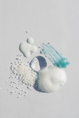 Cosmetic smears and drops. Appearance of the texture of the cream, oil and granules on a white...