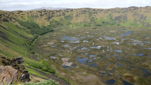A large volcanic crater on Easter Island. Rano Kau crater. Orongo Crater from ridge in Easter Island, Chile. A crater on exotic volcanic island, Rapa Nui.
