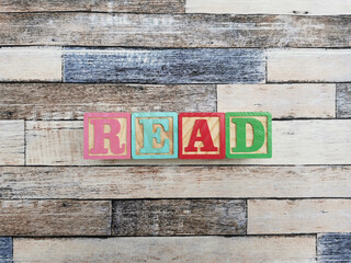 Read. The word read from wooden letter blocks. Fit for educational media, teaching, childrens book, etc