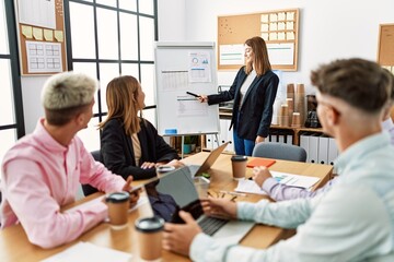 Group of business workers listening boss conference during meeting at the office.