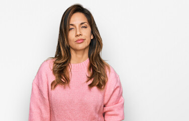 Obraz premium Young hispanic woman wearing casual clothes looking sleepy and tired, exhausted for fatigue and hangover, lazy eyes in the morning.
