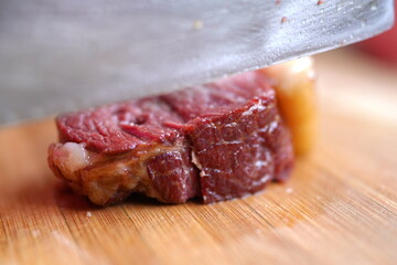 Cooked horse meat on cutting board