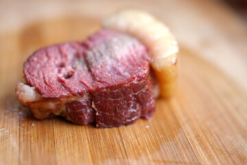 Cooked horse meat on cutting board