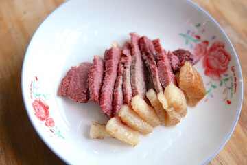 Cooked horse meat on cutting board