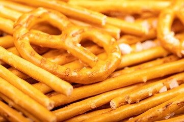 Crispy bread straws with salt, close-up, selective focus, top view.