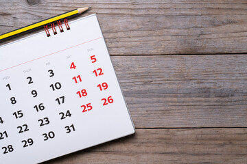 close up of calendar on the wooden table background, planning for business meeting or travel...