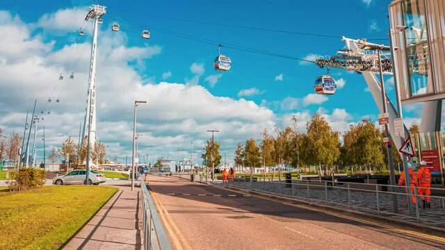 Timelapse view of the Emirates Air Line cable car over river Thames. Transport at Greenwich over to Royal Docks in London, UK. 