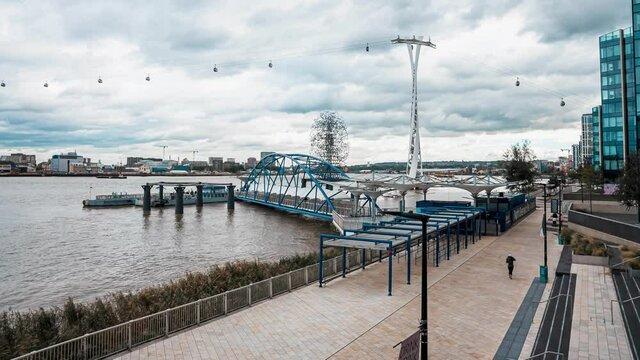 Timelapse view of the Emirates Air Line cable car over river Thames. Transport at Greenwich over to Royal Docks in London, UK. 