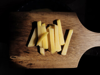 Shoestrings on a cutting board