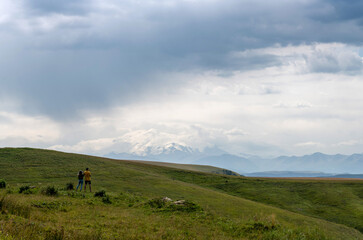 The couple looks at Mount Elbrus