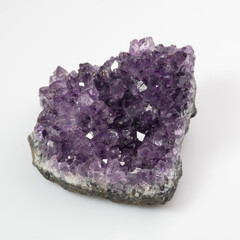 natural violet amethyst druse cluster on the white background