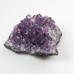 natural violet amethyst druse cluster on the white background