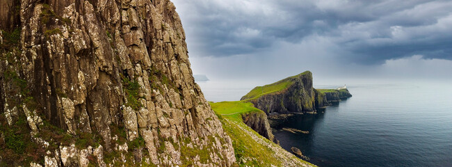 Overcast skies and gathering storm over Point of Neist Light House, Isle of Skye, Scotland