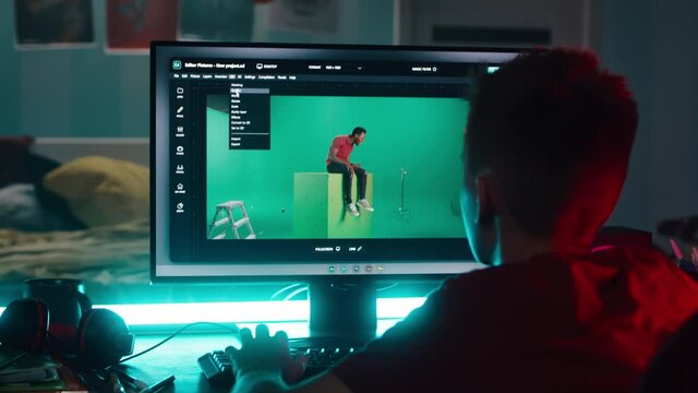 Teenager using 3D software on computer