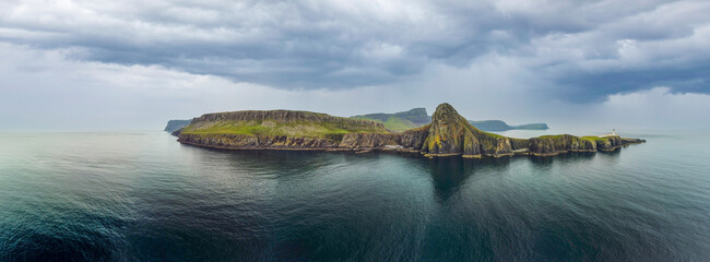 Overcast skies and gathering storm over Point of Neist Light House, Isle of Skye, Scotland