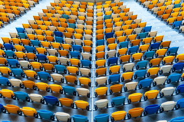 Closeup of yellow and blue seats on stadium