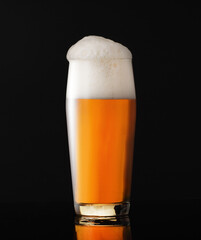 Glass mug with beer and foam