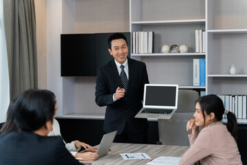 A group of businessmen are meeting, presenting ideas, brainstorming, or reporting on work in the conference room. in business meeting and teamwork concept