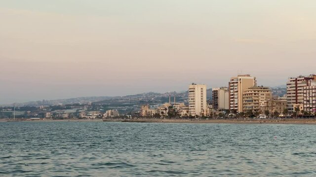 The city of Sidon in Lebanon. Sidon Sea Castle, built by the crusaders - Saida corniche and building. Sidon sea at sunset