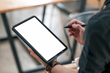 man hand holding blank screen portable tablet and stylus pen.