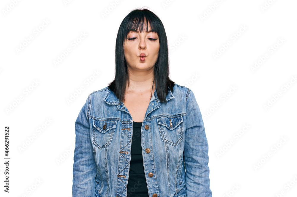 Poster Young hispanic woman wearing casual clothes making fish face with lips, crazy and comical gesture. funny expression.