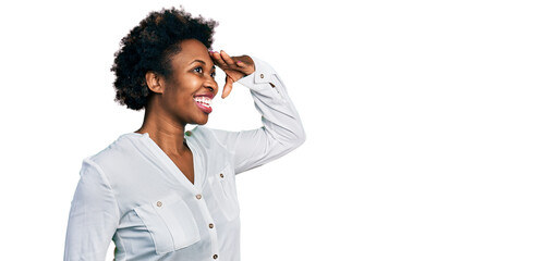 African american woman with afro hair wearing casual white t shirt very happy and smiling looking...