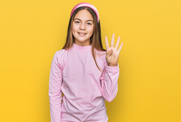 Beautiful brunette little girl wearing casual turtleneck sweater showing and pointing up with fingers number four while smiling confident and happy.