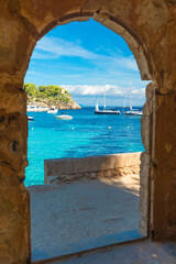 Fototapeta na wymiar Sea view through an old archway of a ruin - Mallorca - 0025