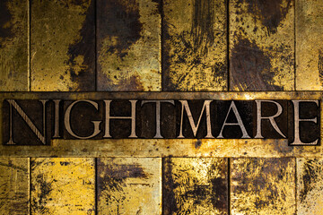 Nightmare text message on textured grunge copper and vintage gold background