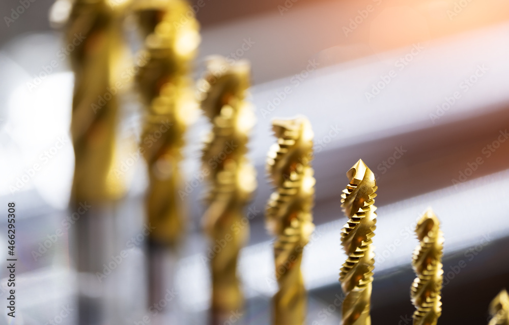 Poster drill bits of different sizes, close-up