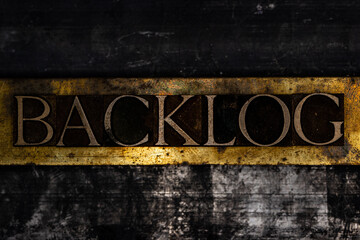 Backlog text on textured grunge copper and vintage gold background