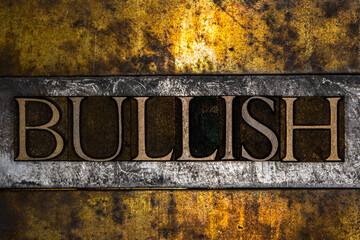 Bullish text on grunge textured gold and copper background