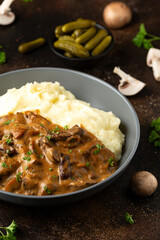 Beef Stroganoff with mushrooms and mashed potatoes.