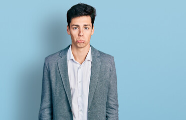Young hispanic man wearing business clothes depressed and worry for distress, crying angry and afraid. sad expression.