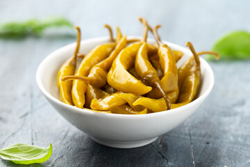 Homemade Pickled Green Chillies in white bowl