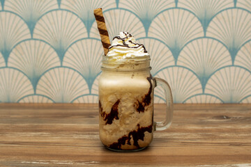 Café frapé is an iced coffee covered with foam made with instant coffee and cream. It is very...